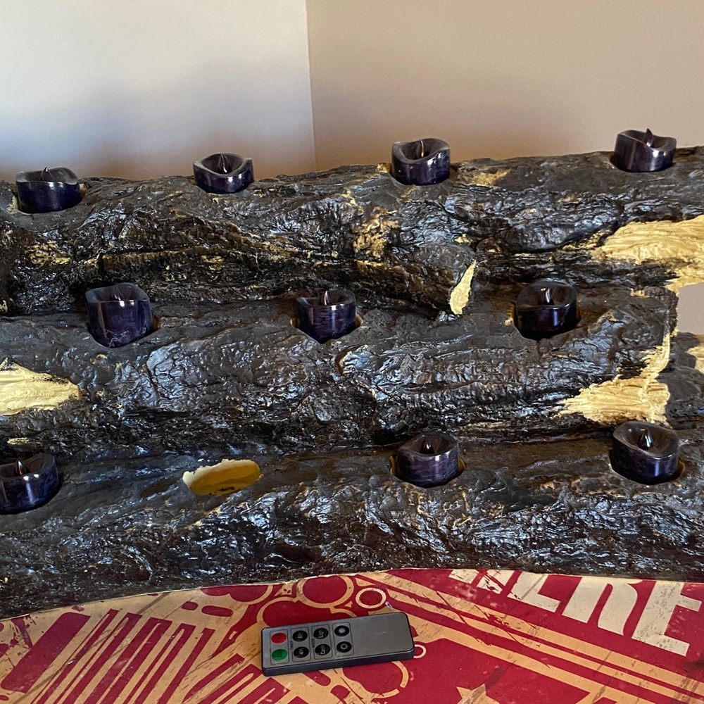 Fireplace logs w remote flickering candles.